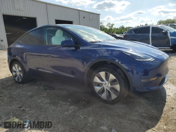 2023 Tesla Model Y Long Range z VIN 7SAYGDEE3PA178832, wystawiony jako Copart lot #57156005 z przebiegiem 12 920 mil mil oraz Szkoda całkowita • Salvage title. Historia ofert i sprzedaży dostępna na DreamBid. Obrazek 4.