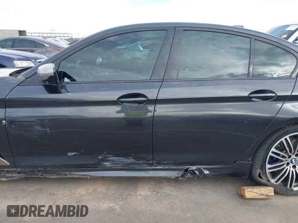 2019 BMW 5 Series M550i xDrive with VIN WBAJB9C51KB287797, listed as a IAAI auction lot 41549311 with 61,459 mi miles and . Bid and sale history available at DreamBid. Image 14.
