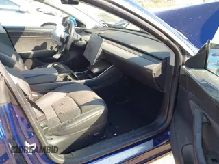 2018 Tesla Model 3 Long Range Battery with VIN 5YJ3E1EA6JF027065, listed as a IAAI auction lot 40532631 with 55,316 mi miles. Bid and sale history available at carsss.com. Image 5.