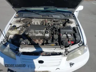 1998 Toyota Camry LE z VIN JT2BF22K9W0090879, wystawiony jako IAAI lot #41860538 z przebiegiem 248 879 mil mil oraz . Historia ofert i sprzedaży dostępna na DreamBid. Obrazek 10.
