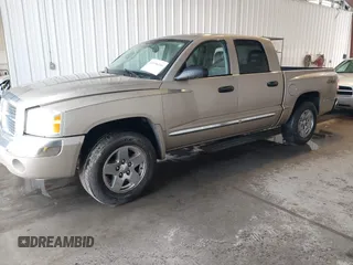 2005 Dodge Dakota Laramie with VIN 1D7HW58N15S159061, listed as a IAAI auction lot 41898306 with 114,288 mi miles and . Bid and sale history available at DreamBid. Image 2.