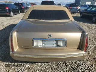 1999 Cadillac DeVille DHS z VIN 1G6KE54Y5XU721363, wystawiony jako Copart lot #79227924 z przebiegiem Nie podano mil oraz Szkoda całkowita • Salvage title. Historia ofert i sprzedaży dostępna na DreamBid. Obrazek 6.