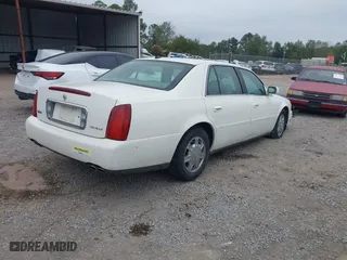 2005 Cadillac DeVille with VIN 1G6KD54Y75U162964, listed as a IAAI auction lot 40794096 with 165,341 mi miles. Bid and sale history available at carsss.com. Image 4.