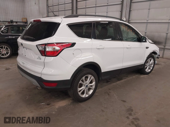 2018 Ford Escape SE z VIN 1FMCU9GD2JUB17518, wystawiony jako IAAI lot #41919245 z przebiegiem 102 626 mil mil oraz . Historia ofert i sprzedaży dostępna na DreamBid. Obrazek 4.