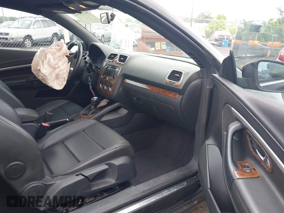 2014 Volkswagen Eos Sport with VIN WVWBW8AH2EV003356, listed as a IAAI auction lot 42394312 with 70,448 mi miles and . Bid and sale history available at DreamBid. Image 5.
