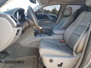 2011 Jeep Grand Cherokee Laredo with VIN 1J4RR4GGXBC642759, listed as a Copart auction lot 55767575 with 144,104 mi miles and Salvage title. Bid and sale history available at DreamBid. Image 7.
