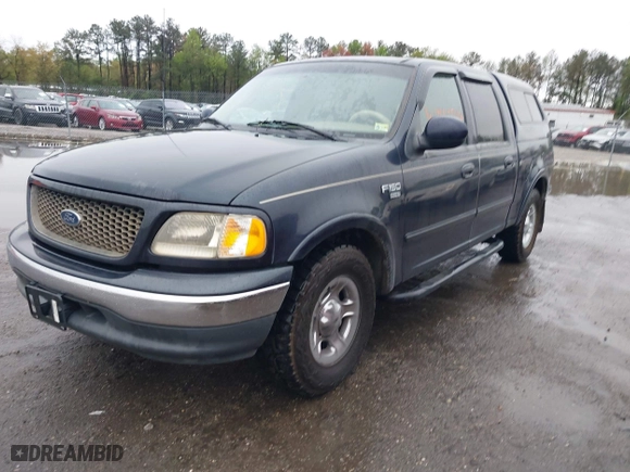 2001 Ford F-150 SuperCrew XLT with VIN 1FTRW07L41KB78053, listed as a IAAI auction lot 41965594 with 303,647 mi miles. Bid and sale history available at carsss.com. Image 2.