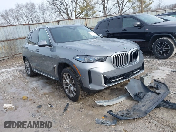 2025 BMW X5 xDrive40i with VIN 5UX23EU02S9X44610, listed as a IAAI auction lot 41469794 with 1,964 mi miles. Bid and sale history available at carsss.com. Image 1.