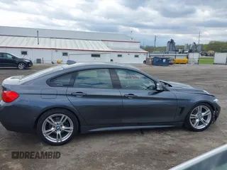 2015 BMW 4 Series 428i xDrive z VIN WBA4A7C5XFD415131, wystawiony jako IAAI lot #42100618 z przebiegiem 89 093 mil mil oraz . Historia ofert i sprzedaży dostępna na DreamBid. Obrazek 13.