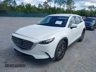 2022 Mazda CX-9 Touring z VIN JM3TCBCY7N0600787, wystawiony jako IAAI lot #42240512 z przebiegiem 27 927 mil mil oraz . Historia ofert i sprzedaży dostępna na DreamBid. Obrazek 2.