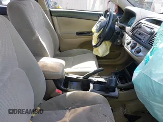 2002 Toyota Camry XLE z VIN 4T1BF32K02U006928, wystawiony jako IAAI lot #41569825 z przebiegiem 188 482 mil mil oraz . Historia ofert i sprzedaży dostępna na DreamBid. Obrazek 5.