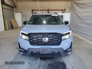 2023 Honda Passport Elite with VIN 5FNYF8H03PB034613, listed as a Copart auction lot 54009215 with 102,841 mi miles and Salvage title. Bid and sale history available at DreamBid. Image 5.