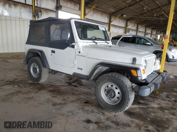 2002 Jeep Wrangler SE with VIN 1J4FA29P12P700276, listed as a Copart auction lot 45109175 with 115,139 mi miles and Salvage Title. Bid and sale history available at DreamBid. Image 4.