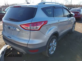 2015 Ford Escape Titanium with VIN 1FMCU0J93FUC02844, listed as a IAAI auction lot 41531293 with 115,392 mi miles and . Bid and sale history available at DreamBid. Image 4.