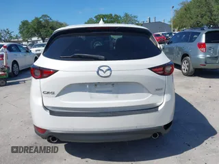 2018 Mazda CX-5 Grand Touring with VIN JM3KFADM2J1422512, listed as a IAAI auction lot 42010801 with 48,567 mi miles and . Bid and sale history available at DreamBid. Image 16.