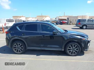2018 Mazda CX-5 Touring z VIN JM3KFACM5J0309533, wystawiony jako IAAI lot #42195429 z przebiegiem 91 928 mil mil oraz . Historia ofert i sprzedaży dostępna na DreamBid. Obrazek 13.