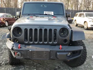 2015 Jeep Wrangler Unlimited Rubicon Hard Rock with VIN 1C4HJWFGXFL671660, listed as a Copart auction lot 82329074 with 214,579 mi miles and Salvage title. Bid and sale history available at DreamBid. Image 5.