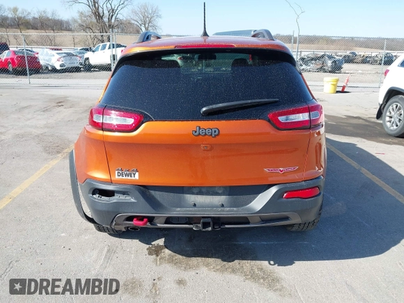2016 Jeep Cherokee Trailhawk with VIN 1C4PJMBBXGW251682, listed as a IAAI auction lot 41973696 with 100,411 mi miles. Bid and sale history available at carsss.com. Image 17.