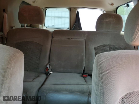 2001 Chevrolet Tahoe LS z VIN 1GNEC13T21J188189, wystawiony jako Copart lot #54394105 z przebiegiem 383 066 mil mil oraz Szkoda całkowita • Salvage title. Historia ofert i sprzedaży dostępna na DreamBid. Obrazek 10.