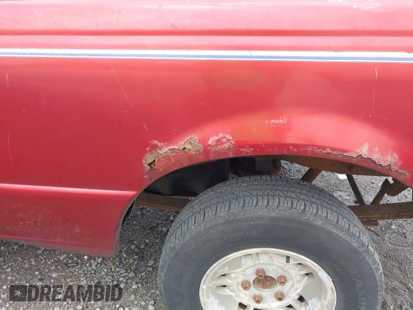 1997 Ford Ranger XLT z VIN 1FTCR10A2VPB59294, wystawiony jako IAAI lot #42676586 z przebiegiem 174 042 mil mil oraz . Historia ofert i sprzedaży dostępna na DreamBid. Obrazek 13.