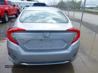 2019 Honda Civic LX with VIN 19XFC2F61KE009471, listed as a IAAI auction lot 42017532 with 81,134 mi miles and . Bid and sale history available at DreamBid. Image 16.