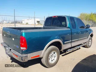 1997 Ford F-150 XL with VIN 1FTEX18LXVKB64986, listed as a IAAI auction lot 41901924 with 224,288 mi miles. Bid and sale history available at carsss.com. Image 4.