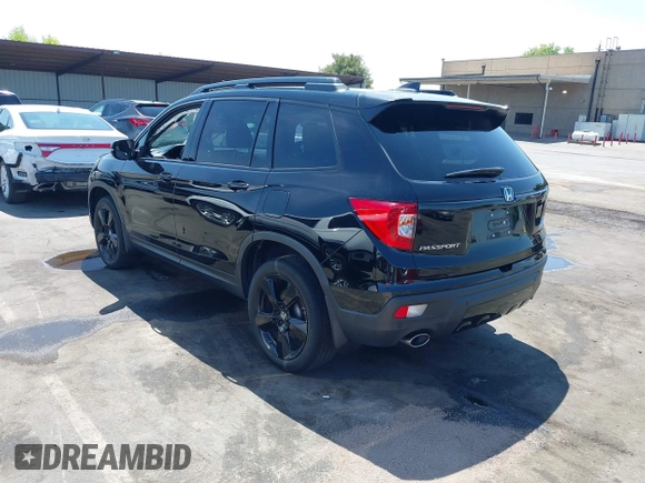 2021 Honda Passport Elite with VIN 5FNYF8H07MB003506, listed as a IAAI auction lot 42571906 with 42,323 mi miles and . Bid and sale history available at DreamBid. Image 3.