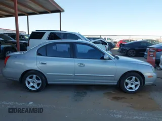 2003 Hyundai Elantra GLS z VIN KMHDN45D43U552485, wystawiony jako IAAI lot #41680449 z przebiegiem 127 899 mil mil oraz . Historia ofert i sprzedaży dostępna na DreamBid. Obrazek 13.