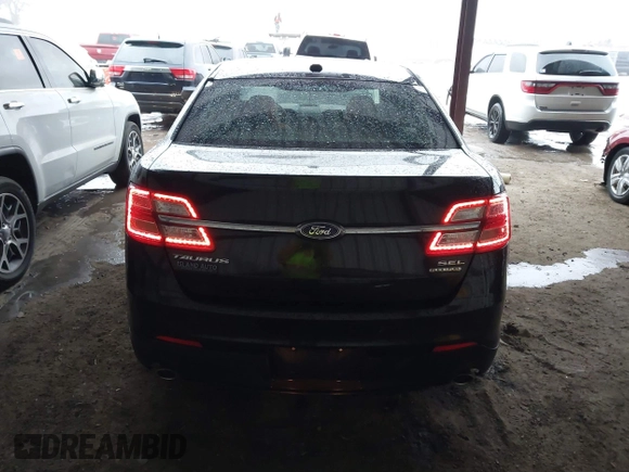 2015 Ford Taurus SEL z VIN 1FAHP2E87FG203272, wystawiony jako IAAI lot #41717231 z przebiegiem 95 829 mil mil oraz . Historia ofert i sprzedaży dostępna na DreamBid. Obrazek 16.