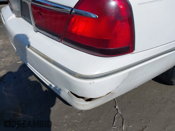 2000 Mercury Grand Marquis LS z VIN 2MEFM75W3YX689323, wystawiony jako IAAI lot #42019687 z przebiegiem 241 045 mil mil oraz . Historia ofert i sprzedaży dostępna na DreamBid. Obrazek 6.