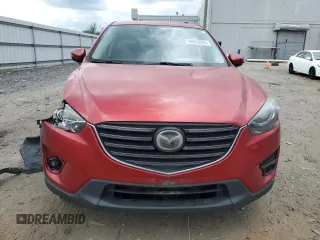 2016 Mazda CX-5 Grand Touring with VIN JM3KE4DY0G0664379, listed as a Copart auction lot 54659005 with 116,022 mi miles and Salvage Title. Bid and sale history available at DreamBid. Image 5.