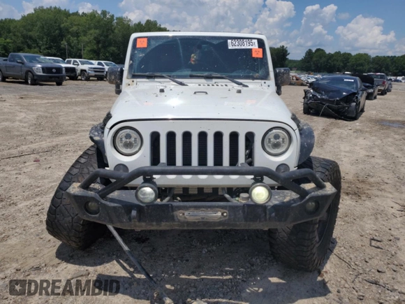 2015 Jeep Wrangler Unlimited Rubicon with VIN 1C4BJWFG6FL710993, listed as a Copart auction lot 62308195 with 103,938 mi miles and Salvage title. Bid and sale history available at DreamBid. Image 5.