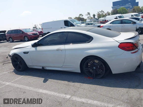 2013 BMW M6 z VIN WBSLX9C52DD159906, wystawiony jako IAAI lot #42095042 z przebiegiem 105 463 mil mil oraz . Historia ofert i sprzedaży dostępna na DreamBid. Obrazek 14.