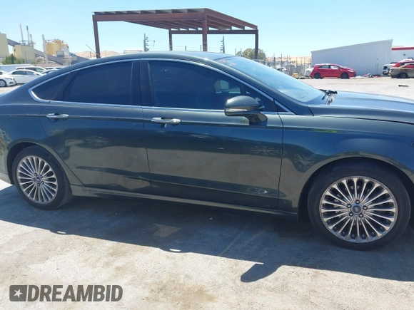 2016 Ford Fusion Titanium with VIN 3FA6P0K98GR196951, listed as a IAAI auction lot 42538508 with 186,298 mi miles and . Bid and sale history available at DreamBid. Image 13.