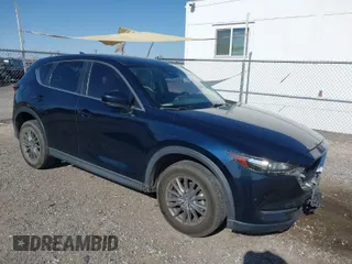 2017 Mazda CX-5 Touring with VIN JM3KFACL5H0180243, listed as a IAAI auction lot 41990818 with 158,977 mi miles. Bid and sale history available at carsss.com. Image 1.