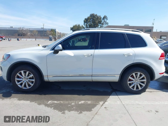 2012 Volkswagen Touareg Sport with VIN WVGEF9BP5CD007294, listed as a IAAI auction lot 41841268 with 160,883 mi miles and . Bid and sale history available at DreamBid. Image 14.