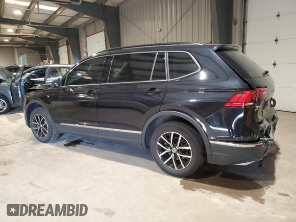 2021 Volkswagen Tiguan SE with VIN 3VV2B7AXXMM071024, listed as a Copart auction lot 52243675 with 31,448 mi miles and Salvage Title. Bid and sale history available at DreamBid. Image 2.