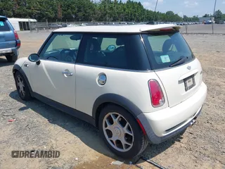 2006 MINI Hardtop S with VIN WMWRE33596TJ37959, listed as a IAAI auction lot 42635457 with 124,440 mi miles and . Bid and sale history available at DreamBid. Image 3.