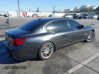 2015 BMW 7 Series 750Li with VIN WBAYE8C52FD780902, listed as a IAAI auction lot 40808265 with 102,774 mi miles. Bid and sale history available at carsss.com. Image 4.