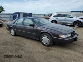 1992 Cadillac Seville z VIN 1G6KY53BXNU804126, wystawiony jako Copart lot #69219394 z przebiegiem 100 647 mil mil oraz Czysty tytuł • Clean title. Historia ofert i sprzedaży dostępna na DreamBid. Obrazek 4.