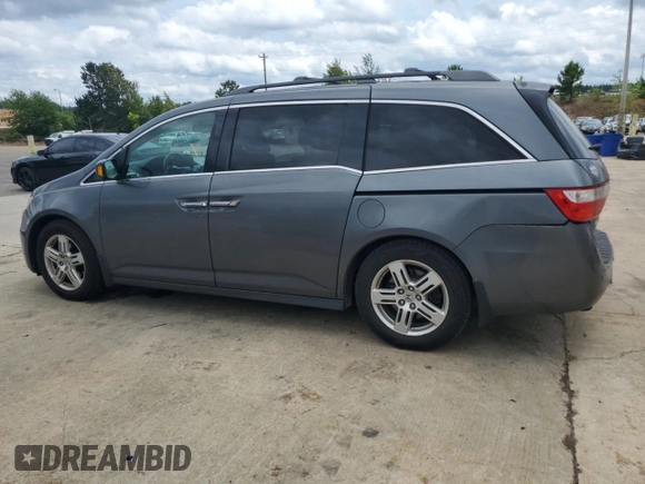 2012 Honda Odyssey Touring with VIN 5FNRL5H90CB050580, listed as a Copart auction lot 58502925 with 226,929 mi miles and Salvage title. Bid and sale history available at DreamBid. Image 2.