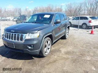 2011 Jeep Grand Cherokee Laredo with VIN 1J4RR4GT0BC543283, listed as a IAAI auction lot 41890109 with 123,325 mi miles. Bid and sale history available at carsss.com. Image 2.