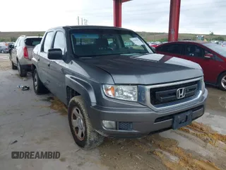 2009 Honda Ridgeline RT with VIN 2HJYK16279H501015, listed as a IAAI auction lot 41996301 with 124,716 mi miles. Bid and sale history available at carsss.com. Image 1.