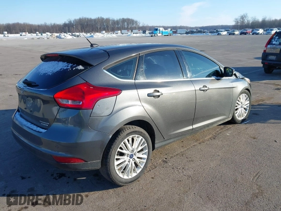 2015 Ford Focus Titanium z VIN 1FADP3N23FL368324, wystawiony jako IAAI lot #41387070 z przebiegiem Nie podano mil oraz . Historia ofert i sprzedaży dostępna na DreamBid. Obrazek 4.