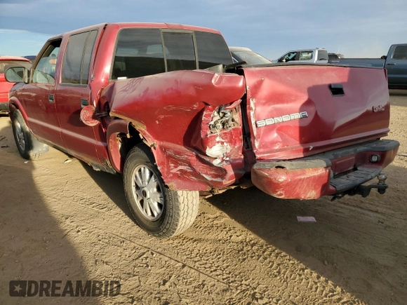 2003 GMC Sonoma SLS with VIN 1GTDT13X43K145574, listed as a Copart auction lot 76300044 with 187,086 mi miles and Salvage Title. Bid and sale history available at DreamBid. Image 2.