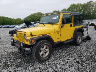 2001 Jeep Wrangler Sport z VIN 1J4FA49S41P358630, wystawiony jako Copart lot #57451305 z przebiegiem 177 899 mil mil oraz Czysty tytuł • Clean title. Historia ofert i sprzedaży dostępna na DreamBid. Obrazek 1.