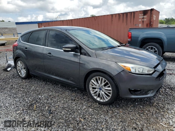 2015 Ford Focus Titanium z VIN 1FADP3N28FL239706, wystawiony jako Copart lot #62478895 z przebiegiem 143 536 mil mil oraz Szkoda całkowita • Salvage title. Historia ofert i sprzedaży dostępna na DreamBid. Obrazek 4.