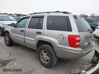 2004 Jeep Grand Cherokee Laredo with VIN 1J4GX48S44C301120, listed as a IAAI auction lot 41281556 with 267,246 mi miles. Bid and sale history available at carsss.com. Image 3.