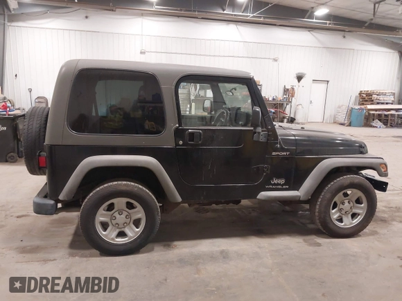 2006 Jeep Wrangler Sport Right Hand Drive with VIN 1J4F449S56P741328, listed as a IAAI auction lot 41476847 with 67,203 mi miles. Bid and sale history available at carsss.com. Image 13.