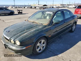 2002 Jaguar X-Type with VIN SAJEA51C12WC33477, listed as a Copart auction lot 83711124 with 165,637 mi miles and Salvage Title. Bid and sale history available at carsss.com. Image 1.